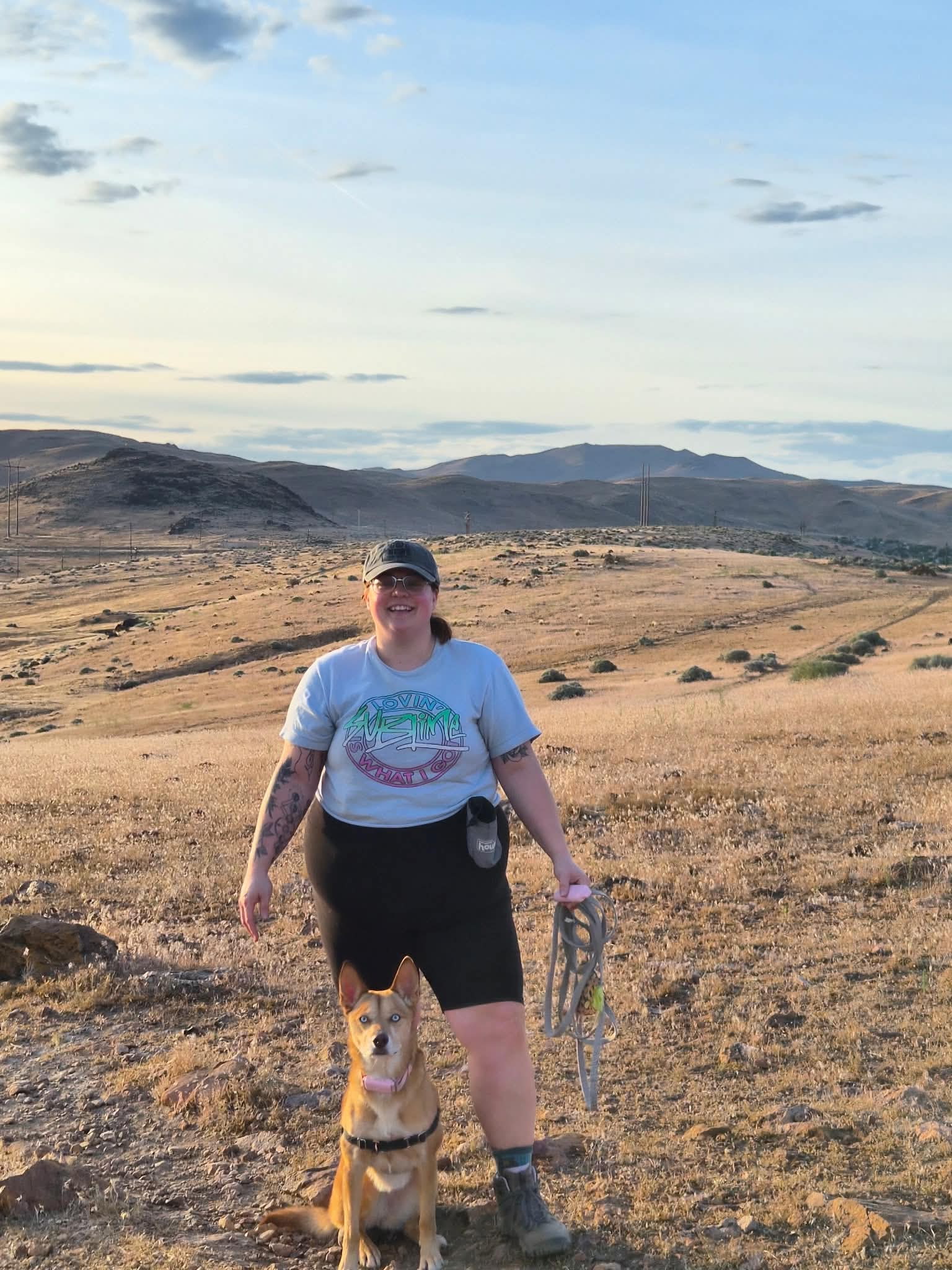 Tabitha hiking outdoors with her dog Canela